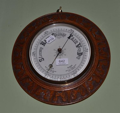 Lot 642 - Carved oak circular wall barometer