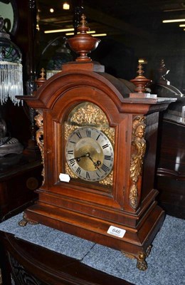 Lot 646 - A walnut cased mantel clock with gilt metal mounts