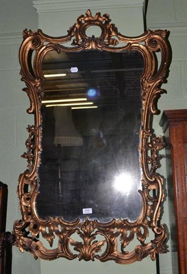 Lot 659 - A decorative gilt framed wall mirror