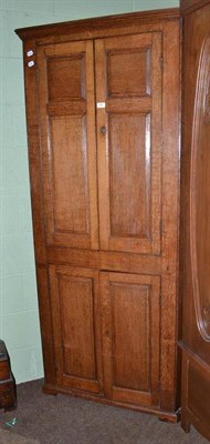 Lot 665 - Georgian oak floor standing corner cupboard