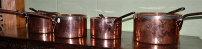 Lot 671 - A set of four copper pans