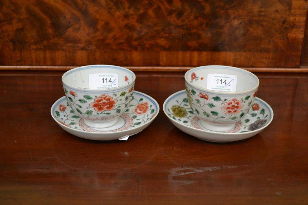 Lot 114 - A Pair of Chinese Porcelain Tea Bowls and Saucers, Kangxi period, painted in red, green, yellow and