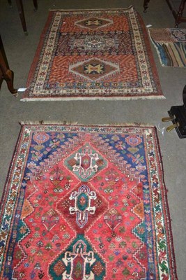 Lot 675 - A Kashgai rug, South East Persia, the field with three stepped medallions framed by spandrels...