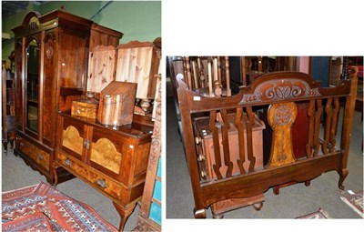 Lot 676 - A late 19th century walnut carved double bed, matching wardrobe, dressing table and washstand