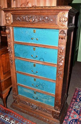 Lot 680 - A late Victorian carved oak Wellington style chest