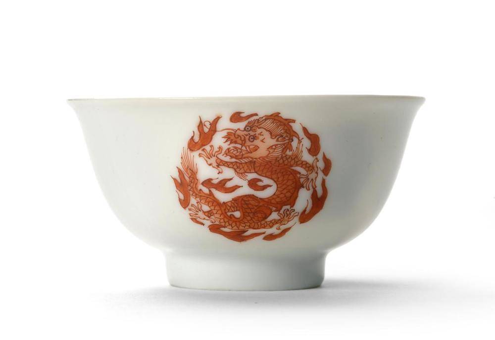 Lot 115 - A Chinese Porcelain Tea Bowl, Yongzheng mark and period, painted in iron red with three...