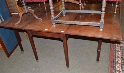 Lot 684 - Georgian mahogany drop leaf table