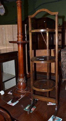 Lot 691 - An oak three tier cake stand and a mahogany standard lamp and shade