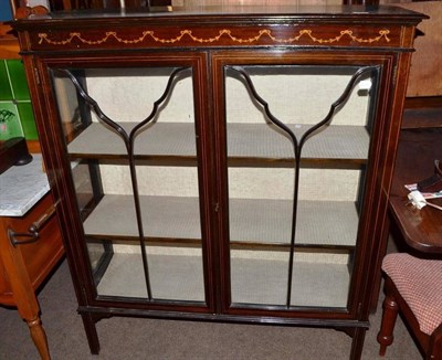 Lot 692 - An Edwardian mahogany display cabinet with glazed doors