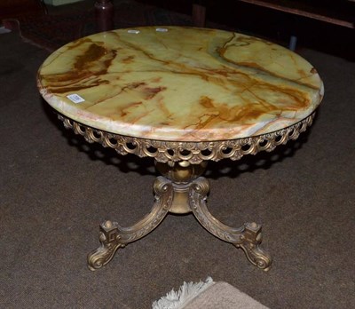 Lot 706 - An onyx top occasional table