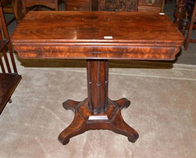 Lot 708 - Early Victorian mahogany swivelling foldover tea table