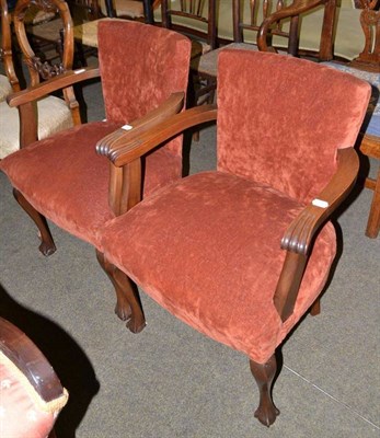 Lot 721 - A pair of 1920's armchairs on claw and ball feet