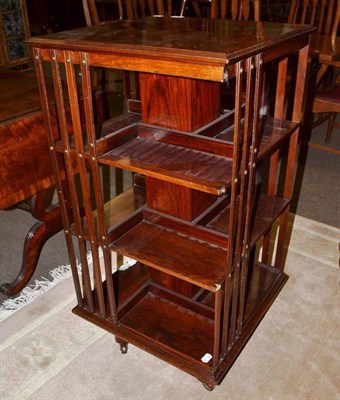 Lot 738 - Edwardian walnut revolving bookcase