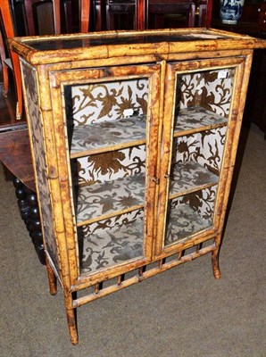 Lot 739 - A bamboo framed two door glazed cabinet