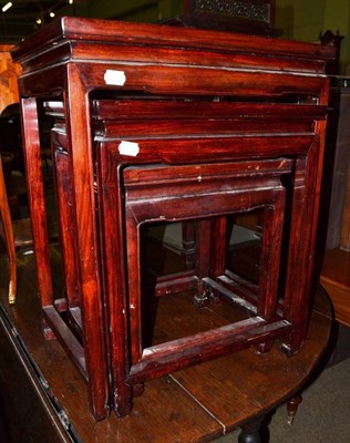 Lot 741 - A nest of three Chinese hardwood tables