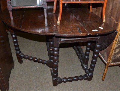 Lot 742 - Oak oval drop leaf gateleg table