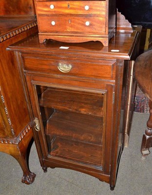 Lot 750 - An Edwardian music cabinet with glazed door