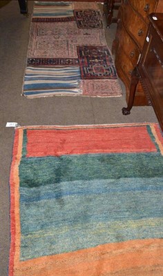 Lot 759 - Kilim rug and a carpet bag face rug (2)