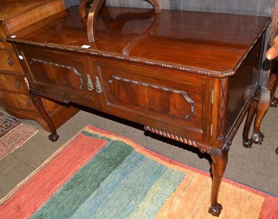 Lot 760 - A 1920/30's reproduction mahogany serving table with two covers and ball and claw feet