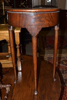 Lot 765 - A small walnut demi-lune foldover side table