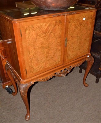 Lot 772 - Walnut cocktail cabinet