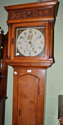 Lot 798 - A carved oak thirty hour longcase clock, with a painted square dial