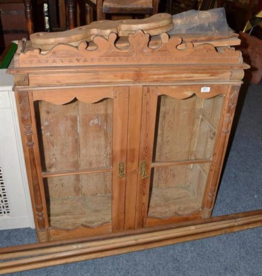 Lot 823 - A Victorian and later pine wall hanging cabinet, with glazed doors and carved pediments, also a...