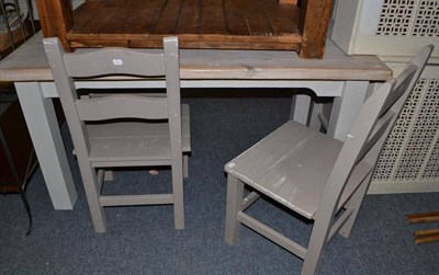 Lot 825 - A modern painted pine top kitchen table and three grey painted chairs