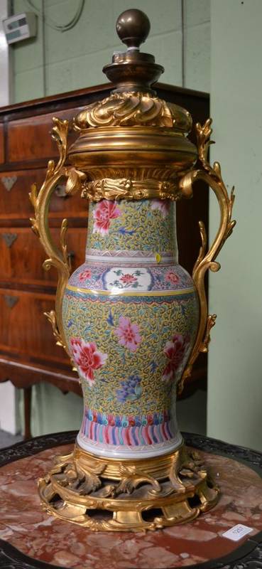 Lot 132 - A Gilt Metal Mounted Chinese Porcelain Baluster Vase, in 18th century style, painted in famille...