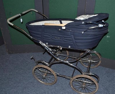 Lot 937 - Carriage built pram in navy blue with chrome folding wheels