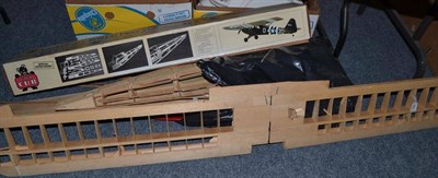 Lot 964 - Part constructed model flying aircraft of a Piper Cub in balsa wood with a large number of parts to