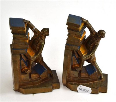 Lot 55 - A pair of American bookends as gentlemen stacking a pile of books