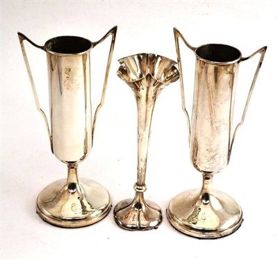 Lot 59 - A pair of silver twin-handled vases and another