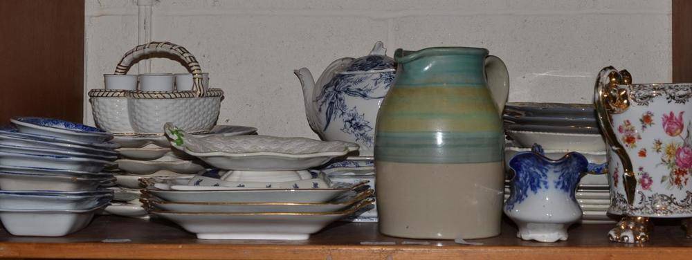 Lot 77 - Shelf of assorted blue and white pottery, Grays pottery jug, egg stand and decorative ceramics etc