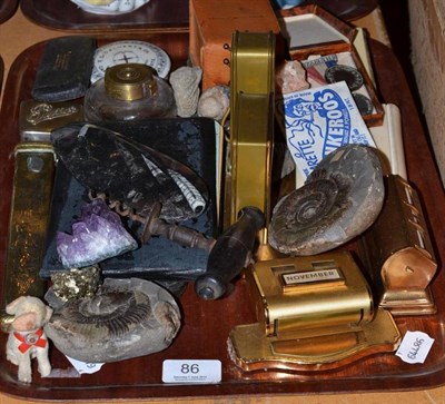 Lot 86 - A tray of assorted collectable items including fossils, desk calendars, silver-mounted prayer book