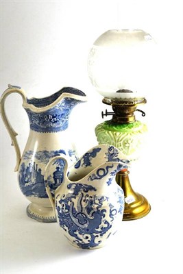 Lot 99 - Brass oil lamp with green glass well and etched shade, E Challins Ardennes pattern blue and...