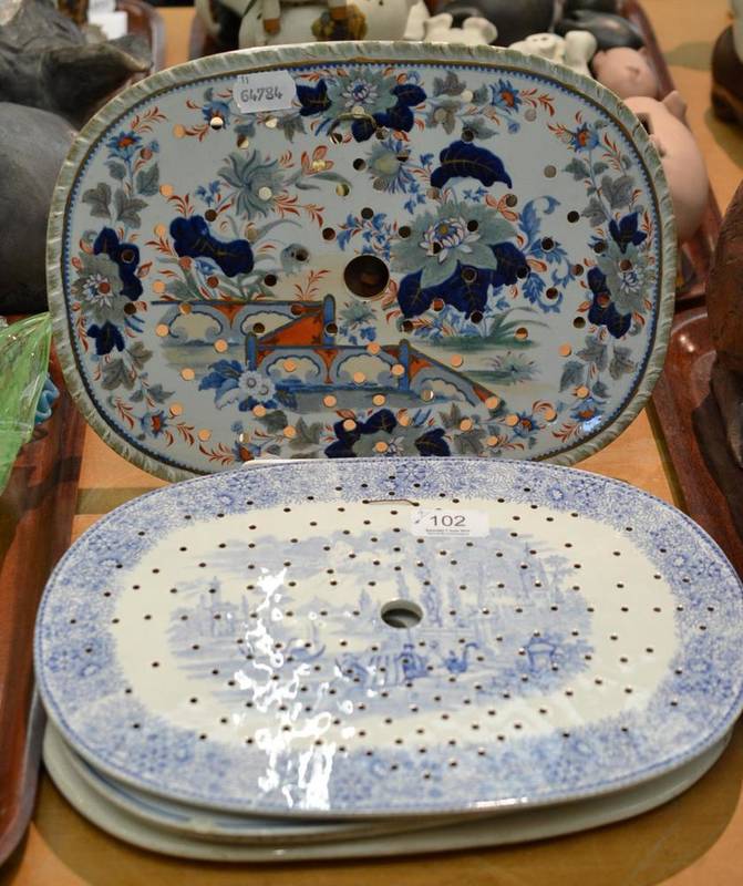 Lot 102 - Stone china drainer dish with hand painted decoration and three blue and white transfer printed...