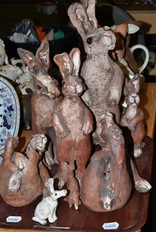 Lot 103 - Shrimp boat pottery groups of hares standing and seated (8)