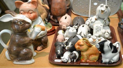 Lot 105 - Tony Wood pig biscuit jar and cover, a rabbit teapot and cover, collection of pottery pigs of...