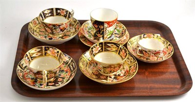 Lot 109 - Five Derby Imari decorated cups and saucers and a side plate
