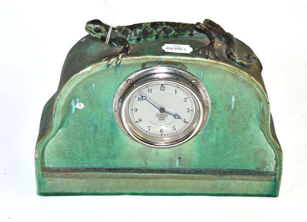 Lot 114 - A circa 1930s Baram ware green pottery mounted mantel clock with a newt to the top