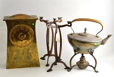 Lot 116 - A brass Arts & Crafts style mantel clock, spirit kettle on stand and a pair of tripod stands