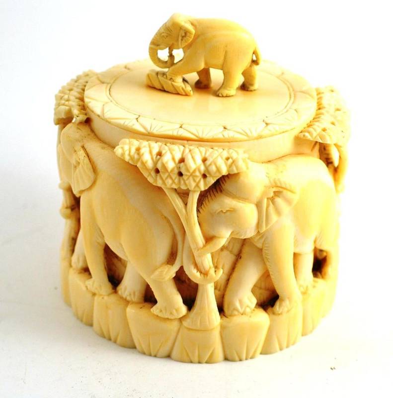 Lot 136 - Ivory tobacco jar, early 20th century, ornately carved with elephants