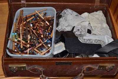 Lot 147 - Assorted lace collars and small items of lace; over one hundred wooden lace-makers bobbins with...