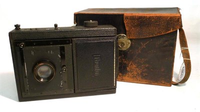 Lot 149 - A Mentor folding Reflex camera outfit, with black leather covered body, Zeiss Tessar f4.5/15cm...