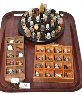 Lot 152 - Collection of thimbles and three wood stands