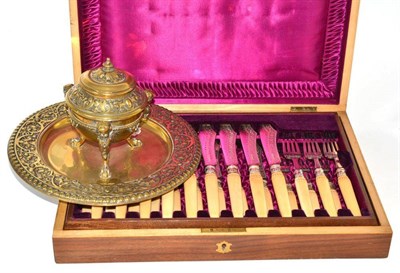 Lot 162 - A cased set of twelve silver plated fish knives and forks in a fitted mahogany case and a brass...