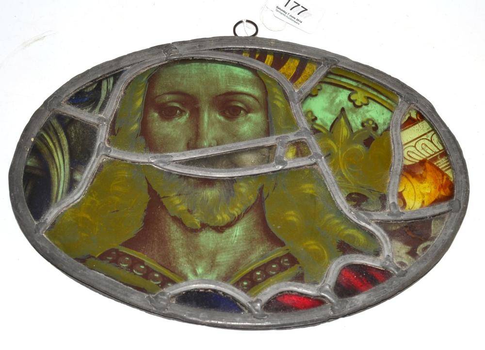 Lot 177 - Oval painted stained glass panel depicting Christ