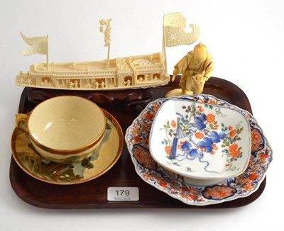 Lot 179 - Chinese ivory boat, Japanese ivory figure, two Imari dishes and a Satsuma cup and saucer