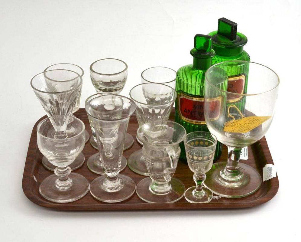 Lot 194 - A collection of early 19th century drinking glasses and two green glass apothecary bottles